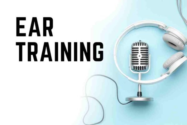 Studio microphone wrapped in white headphones on blue background, representing vocal ear training for all ages in the Voice 360 course series.